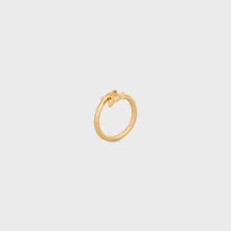 Anillo asimétrico Triomphe en latón con acabado dorado