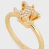 Anillo solitario Triomphe con brillos de strass y latón con acabado dorado Anillo solitario Triomphe con brillos de strass y latón con acabado dorado