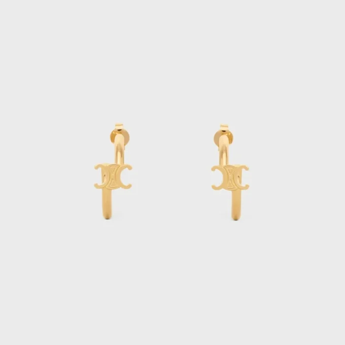 Aros asimétricos Triomphe en latón con acabado dorado Aros asimétricos Triomphe en latón con acabado dorado