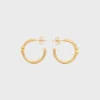 Aros asimétricos Triomphe en latón con acabado dorado Aros asimétricos Triomphe en latón con acabado dorado