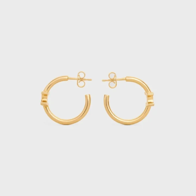 Aros asimétricos Triomphe en latón con acabado dorado Aros asimétricos Triomphe en latón con acabado dorado