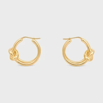 Aros dobles con nudo en latón con acabado dorado