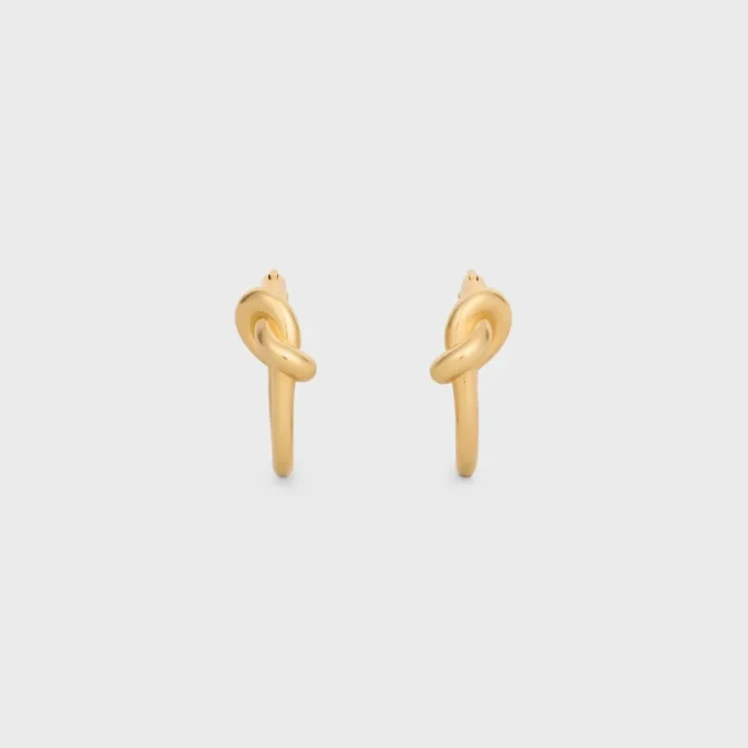 Aros pequeños Knot en latón con acabado dorado Aros pequeños Knot en latón con acabado dorado