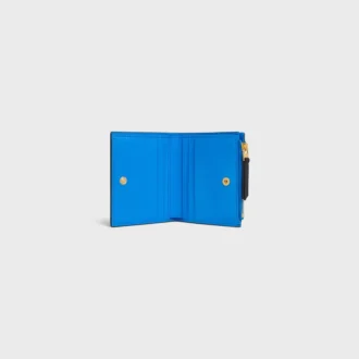Billetera compacta Triomphe Stamp en piel de becerro granulada y flexible