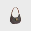 Bolso Ava Triomphe mediano en Triomphe Canvas y piel de becerro Bolso Ava Triomphe mediano en Triomphe Canvas y piel de becerro