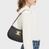 Bolso Ava Triomphe mediano en Triomphe Canvas y piel de becerro Bolso Ava Triomphe mediano en Triomphe Canvas y piel de becerro