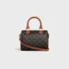 Bolso Boston pequeño en Triomphe Canvas y piel de becerro Bolso Boston pequeño en Triomphe Canvas y piel de becerro