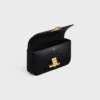 Bolso de hombro con cadena Claude en piel de becerro brillante