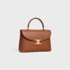Bolso Nino mediano en piel de becerro granulada y flexible
