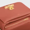 Bolso Teen Triomphe en piel de becerro brillante