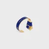 Brazalete anudado CELINE Ribbon en esmalte y latón con acabado dorado Brazalete anudado CELINE Ribbon en esmalte y latón con acabado dorado