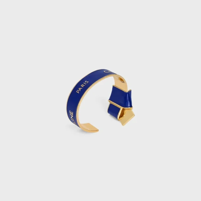 Brazalete anudado CELINE Ribbon en esmalte y latón con acabado dorado Brazalete anudado CELINE Ribbon en esmalte y latón con acabado dorado