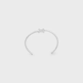 Brazalete asimétrico Triomphe en latón con acabado de rodio