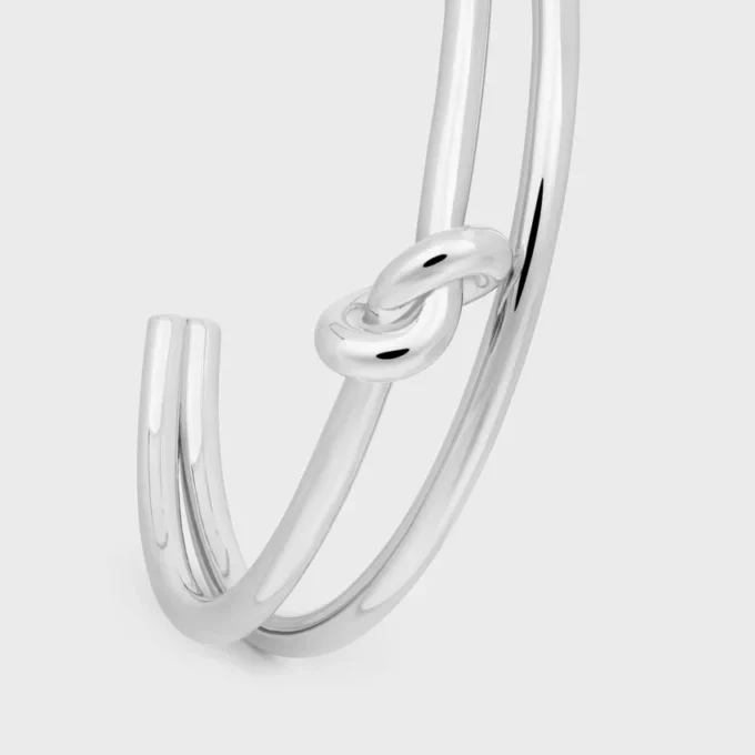 Brazalete doble con nudo en latón con acabado de rodio Brazalete doble con nudo en latón con acabado de rodio