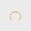 Brazalete doble con nudo en latón con acabado dorado Brazalete doble con nudo en latón con acabado dorado