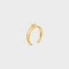 Brazalete doble con nudo en latón con acabado dorado Brazalete doble con nudo en latón con acabado dorado
