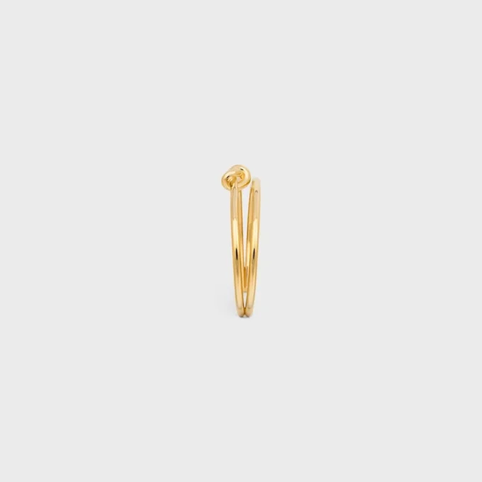 Brazalete doble con nudo en latón con acabado dorado Brazalete doble con nudo en latón con acabado dorado