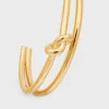 Brazalete doble con nudo en latón con acabado dorado Brazalete doble con nudo en latón con acabado dorado