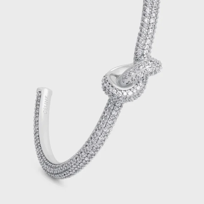 Brazalete Knot Sparkle en strass y latón con acabado de rodio Brazalete Knot Sparkle en strass y latón con acabado de rodio