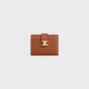 Cartera Nino con correa fina en piel de becerro granulada flexible