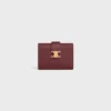 Cartera Nino con correa fina en piel de becerro granulada flexible