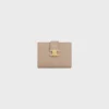 Cartera Nino con correa fina en piel de becerro granulada flexible