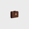 Cartera Nino con correa fina en piel de becerro granulada flexible