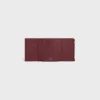 Cartera Nino con correa fina en piel de becerro granulada flexible