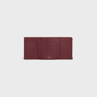 Cartera Nino con correa fina en piel de becerro granulada flexible