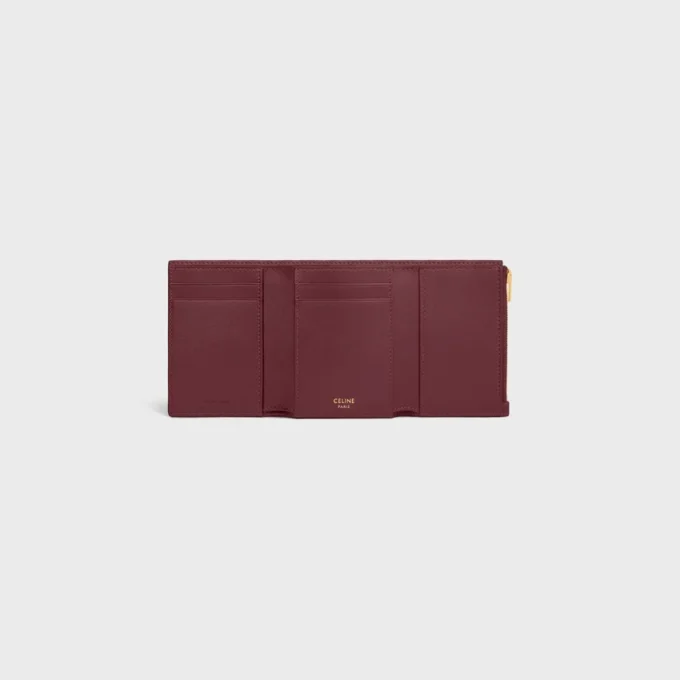 Cartera Nino con correa fina en piel de becerro granulada flexible