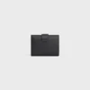 Cartera Nino con correa fina en piel de becerro granulada flexible