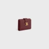 Cartera Nino con correa fina en piel de becerro granulada flexible