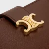 Cartera Nino con correa fina en piel de becerro granulada flexible