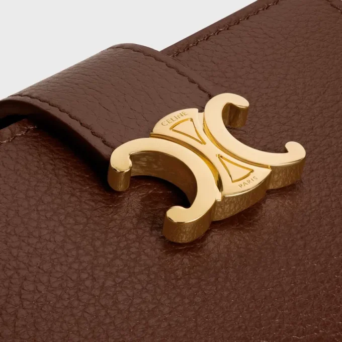 Cartera Nino con correa fina en piel de becerro granulada flexible