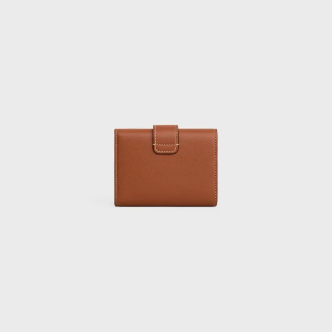 Cartera Nino con correa fina en piel de becerro granulada flexible