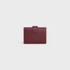 Cartera Nino con correa fina en piel de becerro granulada flexible