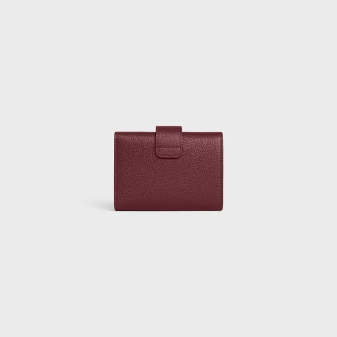 Cartera Nino con correa fina en piel de becerro granulada flexible