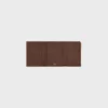 Cartera Nino con correa fina en piel de becerro granulada flexible