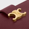 Cartera Nino con correa fina en piel de becerro granulada flexible