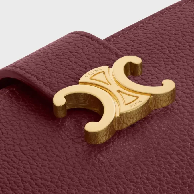 Cartera Nino con correa fina en piel de becerro granulada flexible