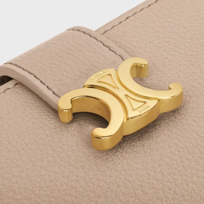 Cartera Nino con correa fina en piel de becerro granulada flexible