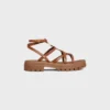 CELINE – Sandalias de tiras Clea Triomphe en piel de becerro – Curtido vegetal CELINE – Sandalias de tiras Clea Triomphe en piel de becerro – Curtido vegetal