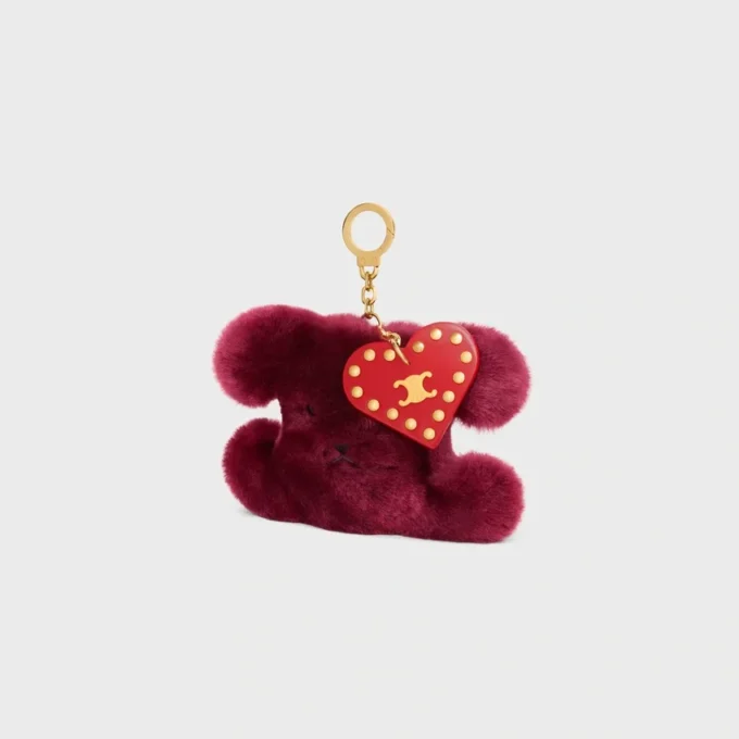 Charm Triomphe con pompón en piel de oveja bordada y piel de becerro Charm Triomphe con pompón en piel de oveja bordada y piel de becerro