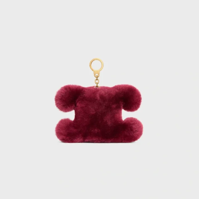 Charm Triomphe con pompón en piel de oveja bordada y piel de becerro Charm Triomphe con pompón en piel de oveja bordada y piel de becerro