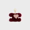 Charm Triomphe con pompón en piel de oveja y piel de becerro Charm Triomphe con pompón en piel de oveja y piel de becerro