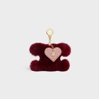 Charm Triomphe con pompón en piel de oveja y piel de becerro