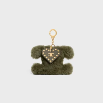 Charm Triomphe con pompón en piel de oveja y piel de becerro