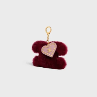 Charm Triomphe con pompón en piel de oveja y piel de becerro