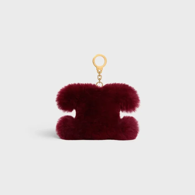 Charm Triomphe con pompón en piel de oveja y piel de becerro Charm Triomphe con pompón en piel de oveja y piel de becerro
