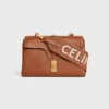 Correa larga de lana con jacquard de CELINE y acabado dorado Correa larga de lana con jacquard de CELINE y acabado dorado